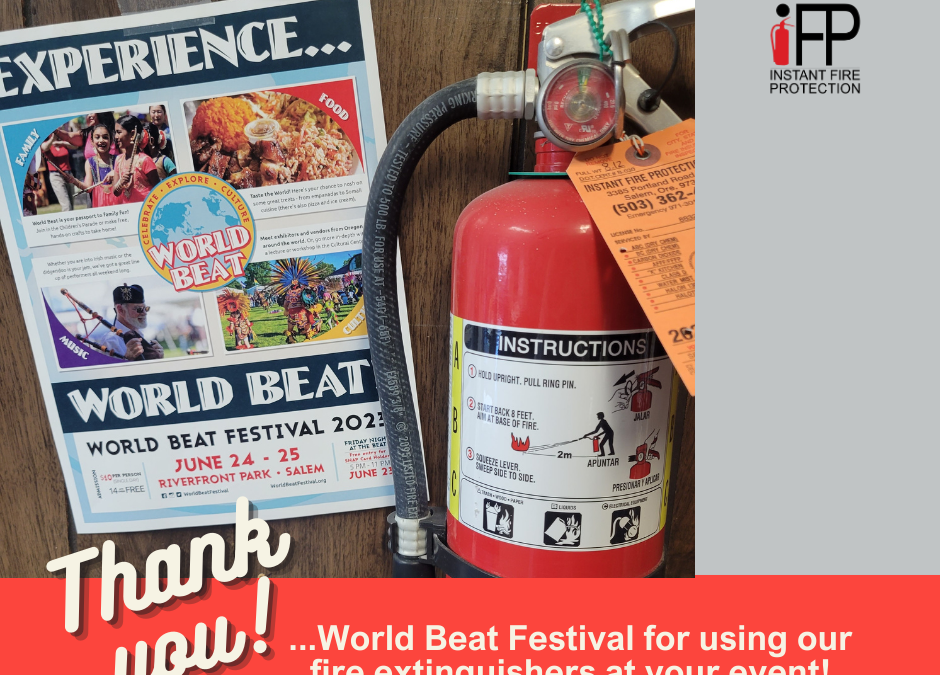 Fire extinguisher hanging by a poster about World Beat Festival