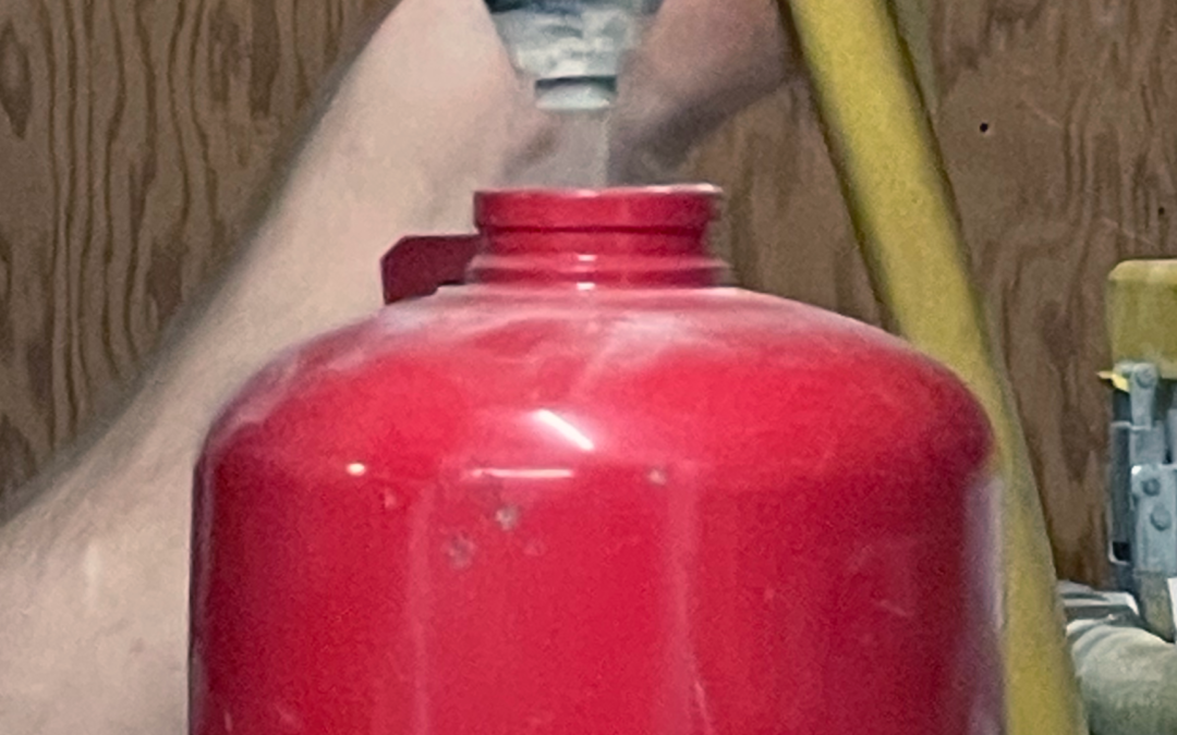 Fire extinguisher being refilled