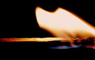 wooden match on fire